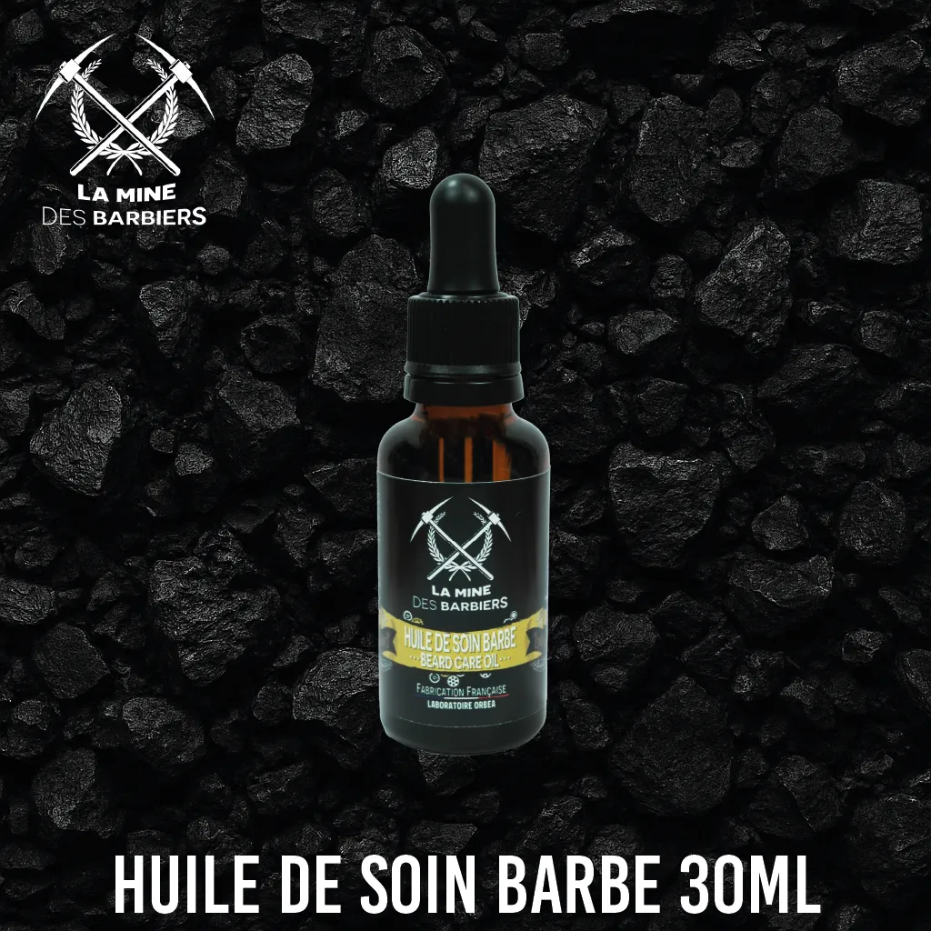 Flacon d’huile de soin barbe 30ml sur fond noir de charbon – La Mine des Barbiers